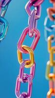 Colorful plastic chains hanging against a bright blue background showcase vibrant design elements photo