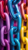 Colorful plastic chains hanging together in vibrant hues create a striking visual display indoors photo