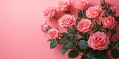 Pink roses arranged artistically against a soft pink background in a charming indoor setting photo