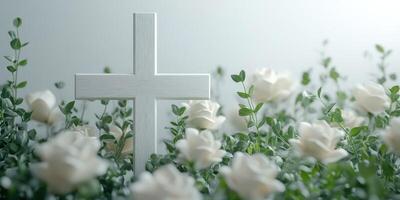 White cross surrounded by blooming white roses in a serene setting at dawn photo