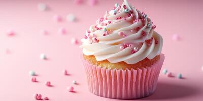 Delicious cupcake topped with pink frosting and colorful sprinkles on a pink background photo