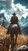 Cowboy rides horseback through mountainous terrain under dramatic sky during late afternoon photo