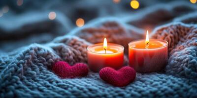 Cozy evening with lit candles and soft hearts on a knitted blanket during winter nights photo