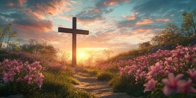Scenic sunset over a tranquil field with a cross and blooming flowers photo
