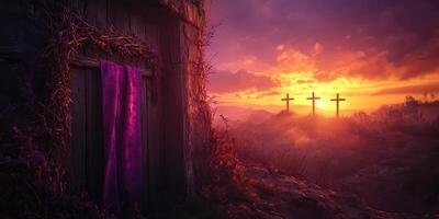 Majestic sunrise illuminating a hillside with crosses and a doorway draped in purple fabric photo