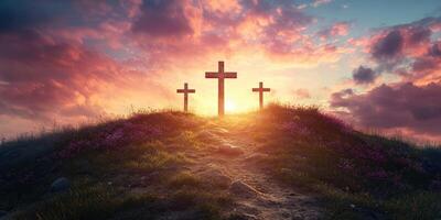 Serenity of three crosses at sunrise illuminating the horizon with vibrant clouds and gentle grass photo