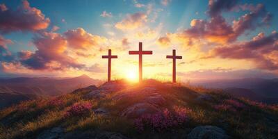 Three wooden crosses stand on a hilltop at sunset, illuminating the sky with vibrant colors and a peaceful atmosphere photo