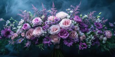 Beautiful arrangement of purple flowers showcasing diverse blooms in soft lighting and subtle mist photo