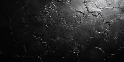 Distinctive black textured surface showcasing natural cracks and uneven patterns in a dramatic lighting setup photo