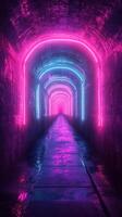 Neon lit tunnel with pink and blue lights creates a surreal atmosphere in an underground setting photo