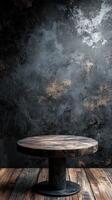 Stylish wooden table against a textured dark wall with a rustic wooden floor in a modern setting photo