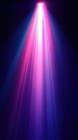 Colorful light beams create an atmospheric backdrop for a vibrant event or performance at night photo