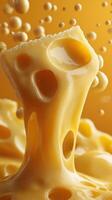 Melting cheese creates a gooey texture with bubbles against a warm yellow background photo