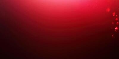 Vibrant red abstract background with soft bokeh lights creating a warm, inviting atmosphere photo