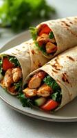 Delicious chicken wraps with fresh vegetables served on a plate for a flavorful meal experience photo