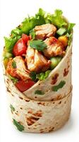 Freshly prepared chicken wrap with vegetables and herbs ready to enjoy at lunch or dinner photo