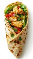 Delicious chicken wrap filled with fresh vegetables and herbs, perfect for a quick meal on the go photo
