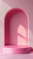 Minimalist pink backdrop with arch and platform ideal for photography and display setups photo