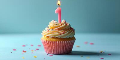 Celebrating a special occasion with a vibrant cupcake topped with a pink number candle against a soft blue background photo