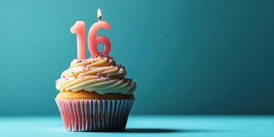 Sweet celebration with a cupcake topped with a pink 16 candle and colorful sprinkles photo