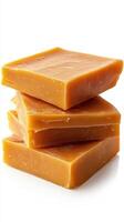 Handcrafted caramel soap bars stacked in a neat arrangement for an aesthetic display photo