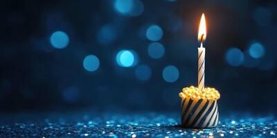 Celebration candle illuminating festive scenery with vibrant blue background during a special occasion photo