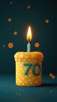 Bright yellow cake with candle celebrating a 70th birthday against a dark background photo