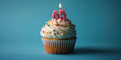 Celebrating a special occasion with a cupcake topped with a candle and colorful sprinkles photo