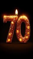 Celebration of a milestone with a sparkling 70 candle lit in dark surroundings photo