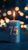 Bright blue candle with a decorative number celebrating a special milestone in a festive atmosphere at night photo