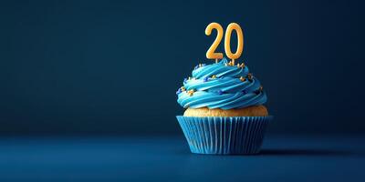 Delightful blue cupcake featuring a yellow number twenty candle, perfect for celebrating a special birthday occasion photo