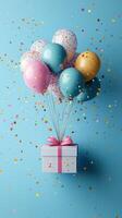 Colorful balloons and confetti celebrate a joyful occasion with a festive gift box against a bright blue backdrop photo