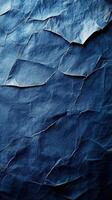 Crumpled blue paper creates a textured backdrop for creative projects and artistic designs photo