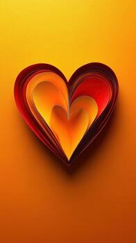 Colorful paper heart crafted with layered shapes in warm hues of red and orange on a bright background photo