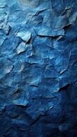 Crumbled blue paper texture showcases deep shades and intricate folds in an artistic, abstract composition for creative use photo