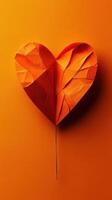 Creative orange paper heart art displayed against a vibrant background to symbolize love and affection during celebrations or events photo