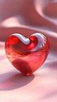 Beautiful red heart-shaped glass sculpture resting on a soft pink fabric background in a serene indoor setting photo