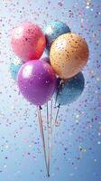 Colorful balloons with confetti floating in the air during a celebration event photo