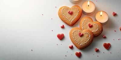 Heart-shaped cookies with candles and red decorations for a romantic celebration photo