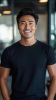 Smiling man in casual black shirt at modern office environment during daytime photo