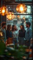 Group of friends enjoying conversation in a cozy cafe during the evening in an urban setting photo