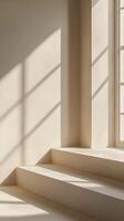 Sunlight filters through windows casting shadows on smooth staircase in minimalist interior setting photo