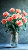 Elegant arrangement of pink roses in a clear glass vase set against a softly lit background photo