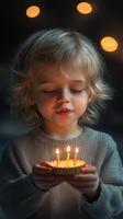 Child celebrating a birthday while blowing out candles on a cake in a cozy, softly lit environment photo