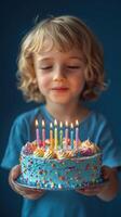 Child celebrates birthday with colorful cake and candles surrounded by joy photo