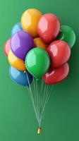 Colorful balloons floating against a vibrant green background, adding joy to any celebration or event setting photo