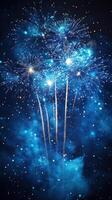 Celebratory fireworks display lighting up the night sky in vibrant blue hues photo