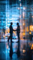 Two businessmen shake hands in a modern office building during the daytime photo