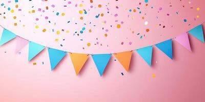 Colorful party decorations create a festive atmosphere with confetti and bunting against a pink backdrop photo