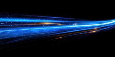 Vibrant blue light streaks create a sense of motion across a dark background at night photo